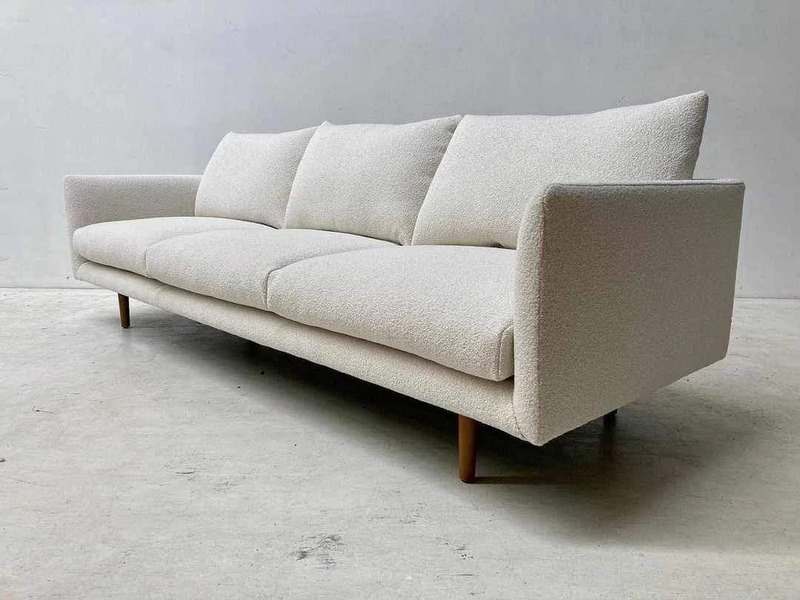 A white minimalist sofa by Cozier.