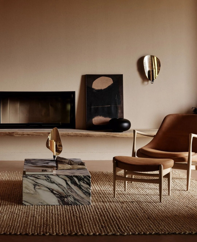 The Elizabeth Lounge Chair by Ib Kofod-Larsen with Flambeau candle holders from Audo Copenhagen.