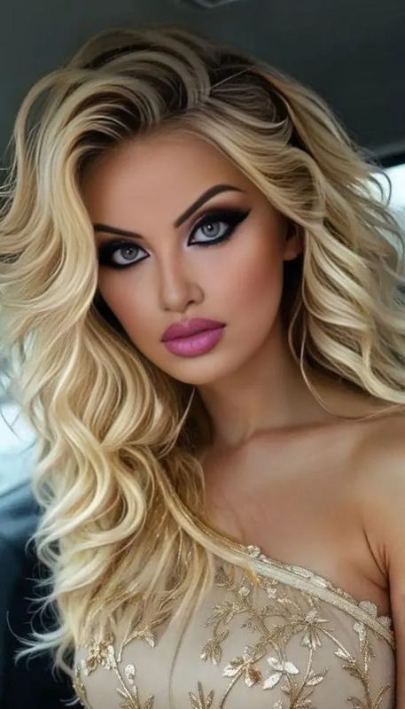 a woman with long blonde hair and blue eyes is posing for a photo in a car