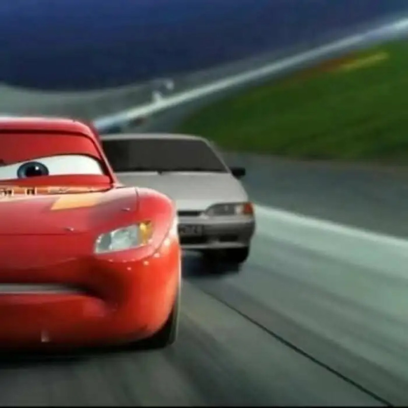 the cars are driving down the road in front of each other on their own side