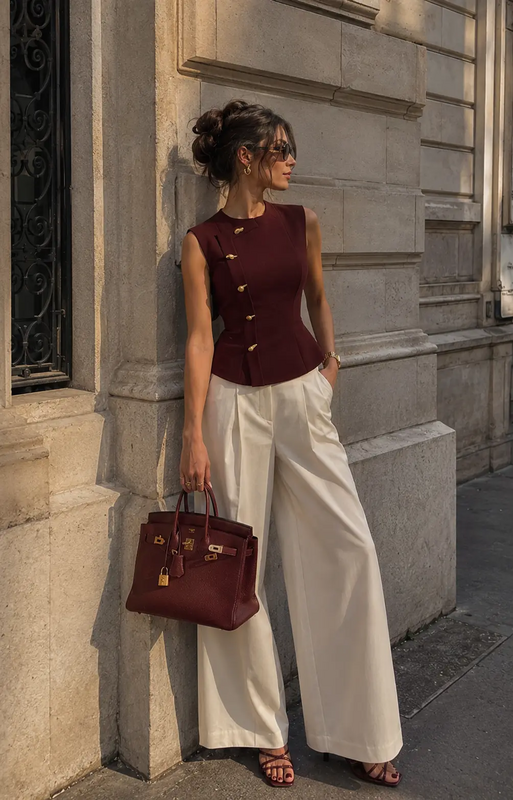 Elegant quiet luxury outfit inspiration featuring a tailored burgundy waist-fit top, cream wide leg trousers, gold accessories, and rich dark cherry heels for the ultimate classy feminine aesthetic. Perfect for old money style lovers, rich girl ae...