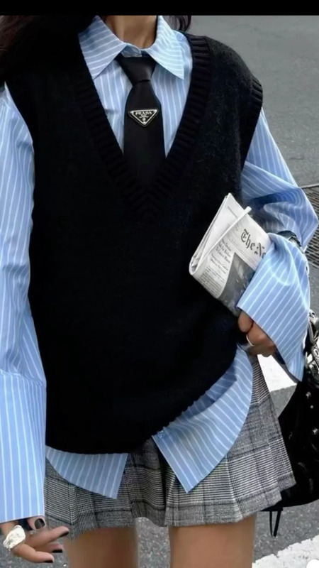 (Contains affiliate link) Dresses in blue and white stripped office dress shirt paired with a black sweater vest, a plaid skirt some chunky rings and a bag. A statement look that gives off dark feminine energy Jogging Outfits, Red Outfits, S...
