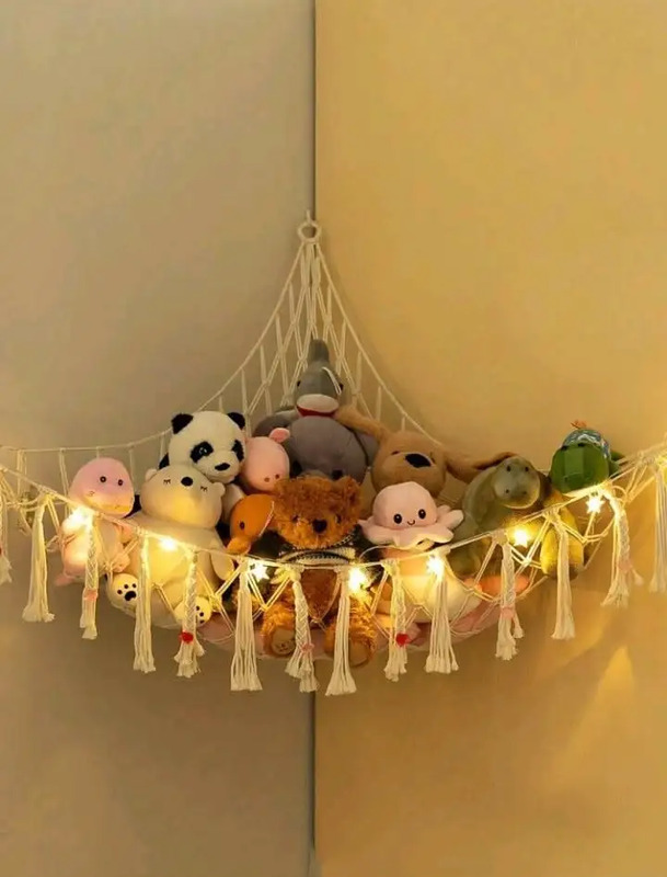 a hammock filled with stuffed animals and lights