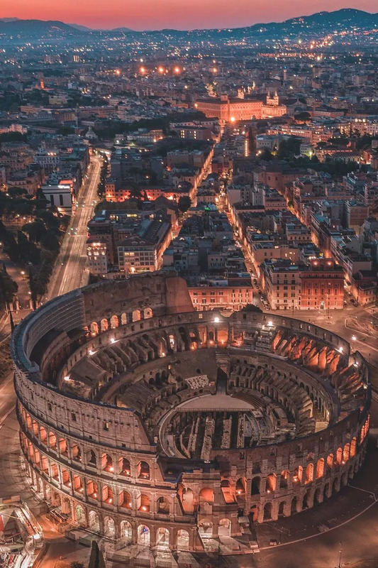 an aerial view of the roman colossion in rome, italy at night time