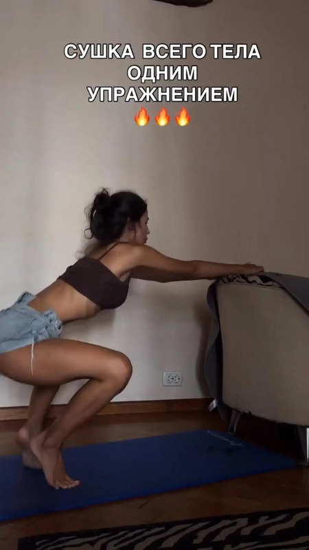 a woman is doing yoga on a mat