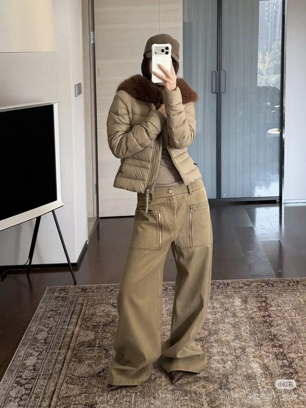 a woman taking a selfie in her living room