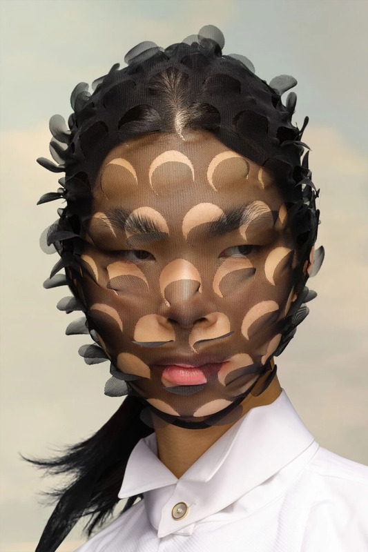 A Fabric Cut-Out Mask by Maison Margiela.