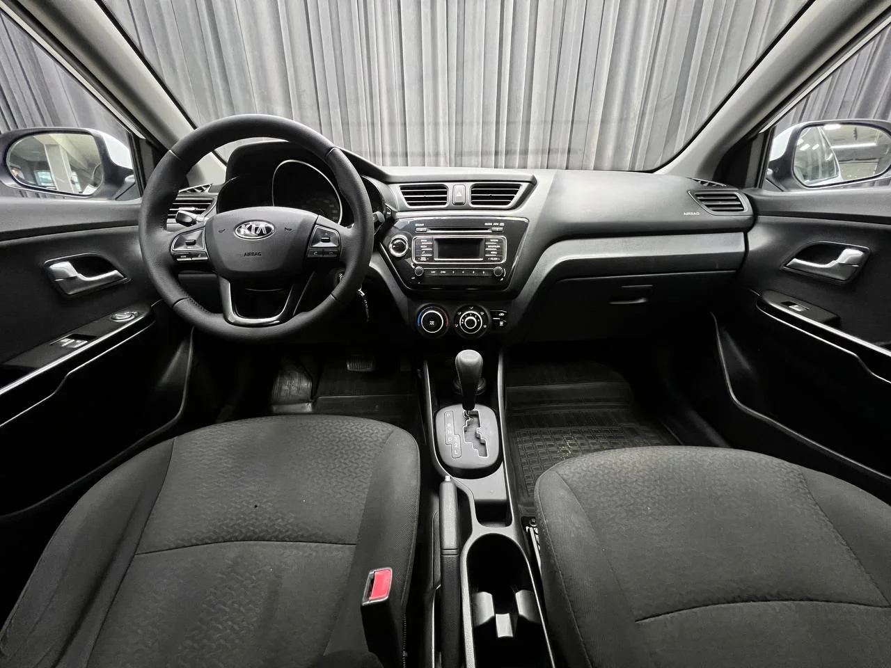 Kia Rio 1.4 AT 2013 год - миниатюра 8