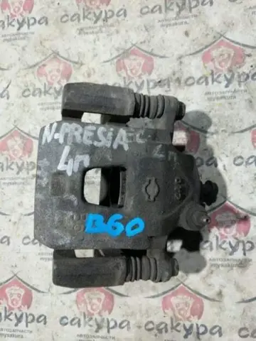 Суппорт Nissan Presea R11 GA15DE Лев. Перед.