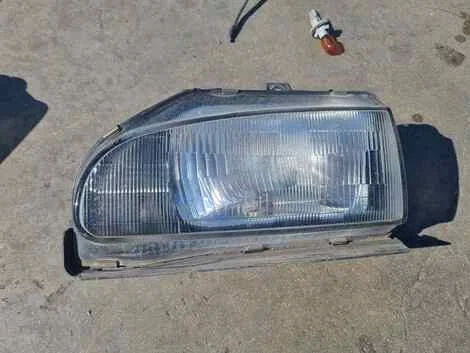 Фара Mitsubishi Minica H22A 3G83 Лев. Перед. - изображение 1