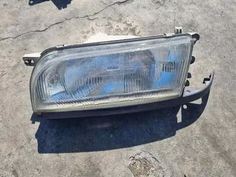 Фара Nissan Avenir W10 SR18DE Лев. Перед.