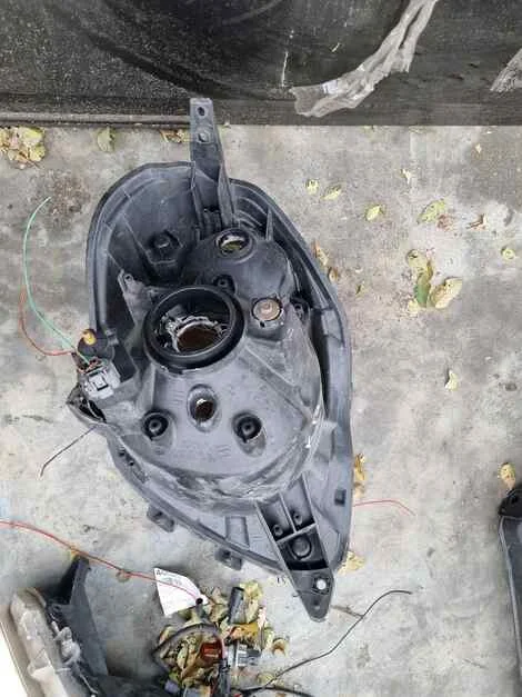 Фара Nissan Moco MG22S K6A Лев. Перед. - миниатюра 3