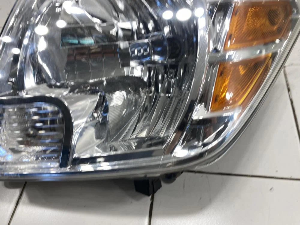 Фара левая Nissan Navara D40 (2004—2010) - миниатюра 6