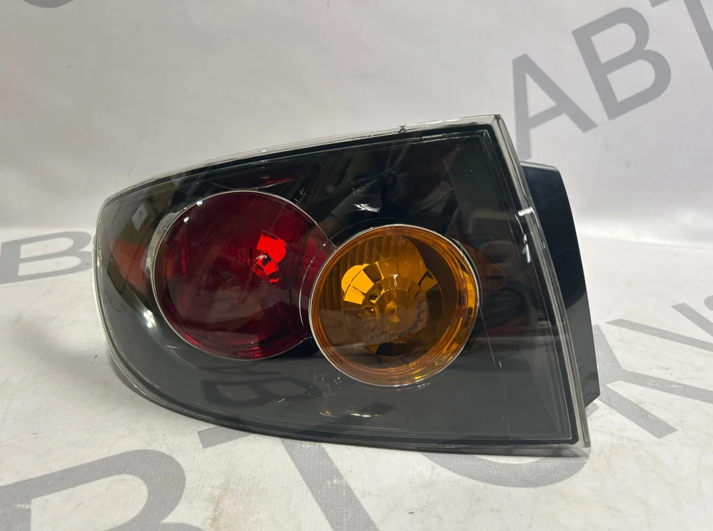 Фонарь задний левый наружный Mazda 3 BK 2003-2006