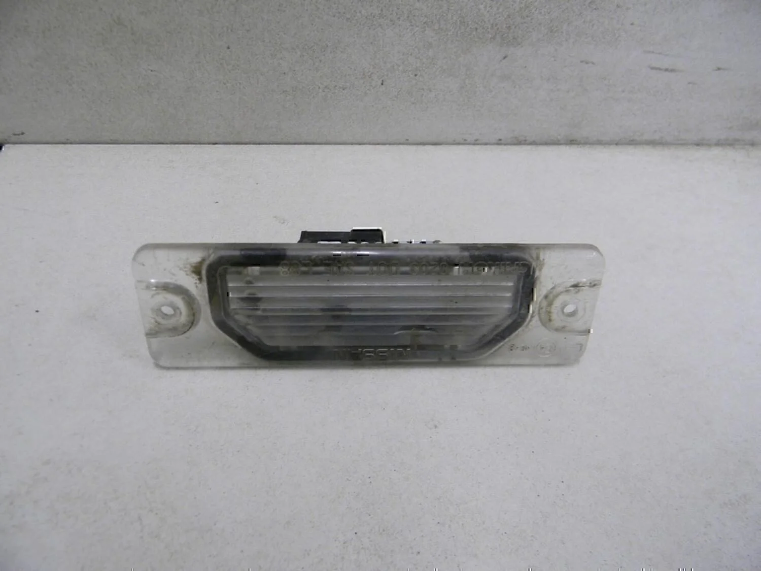 Фонарь подсветки номера NISSAN Almera N15 1995-2000 - изображение 1