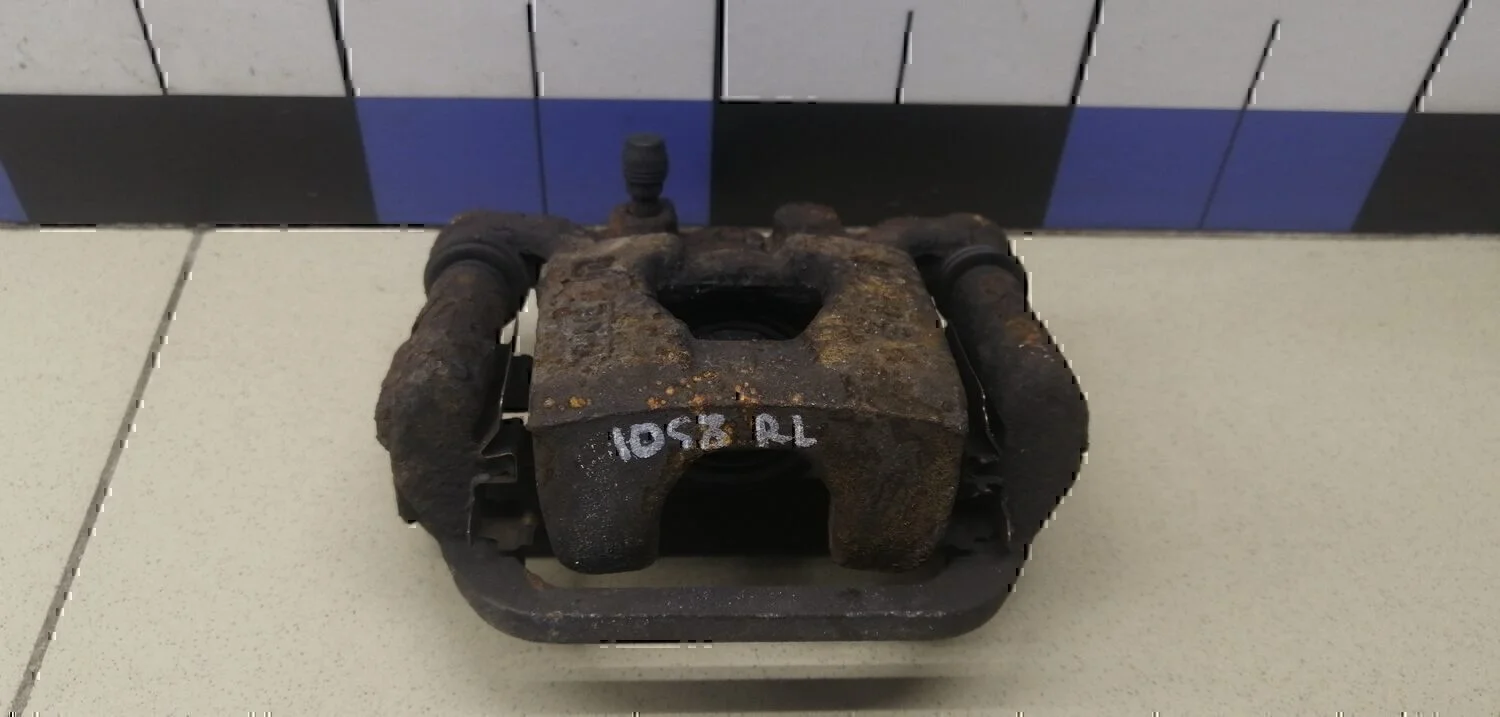 Суппорт задний левый NISSAN Juke (F15) 2011>