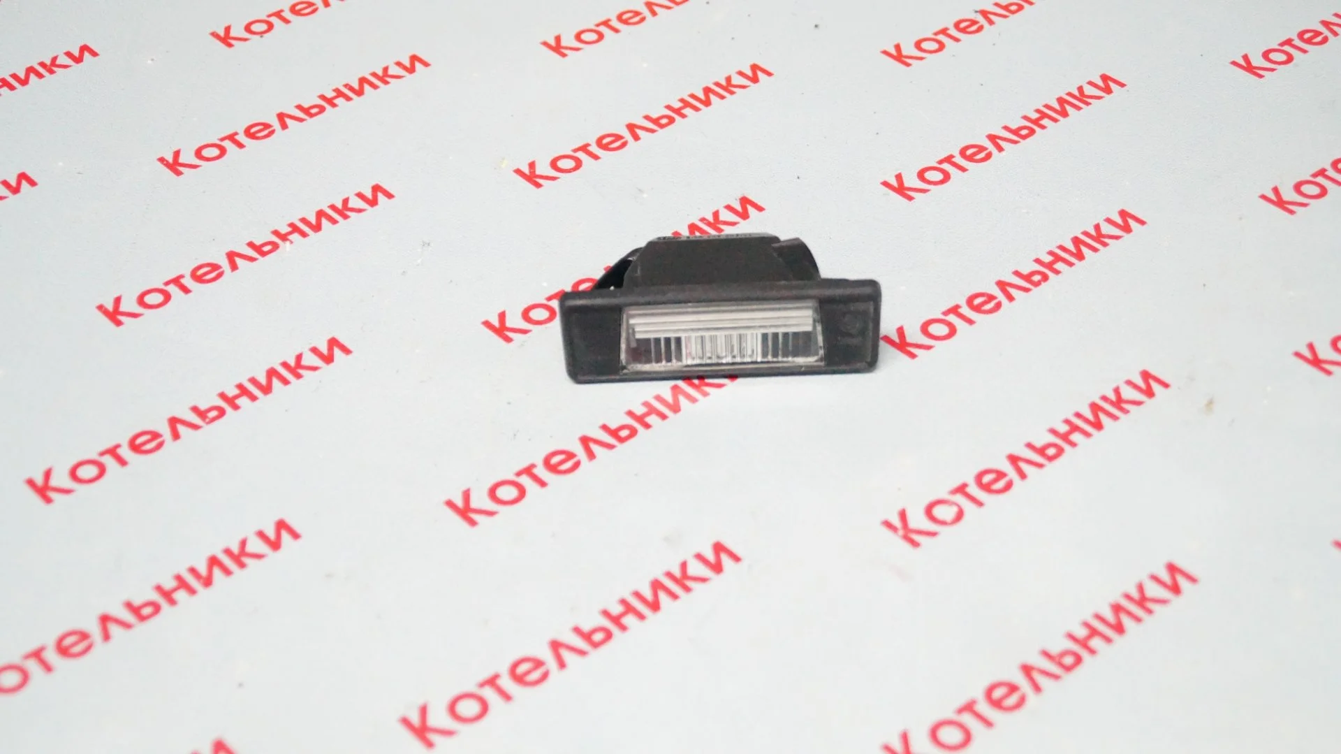 Nissan 26510-JD00A Фонарь подсветки номера - изображение 1