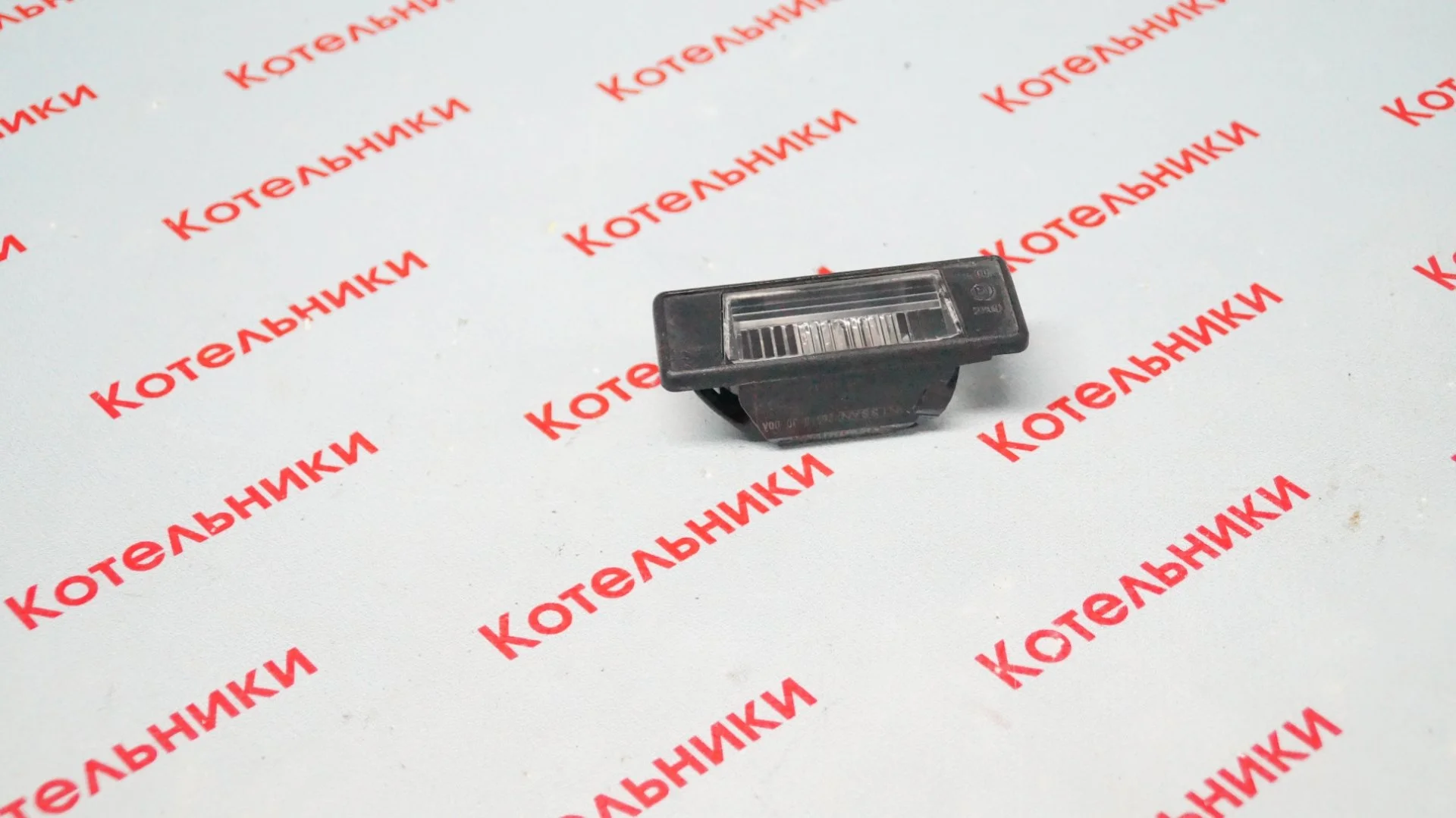 Nissan 26510-JD00A Фонарь подсветки номера - миниатюра 2