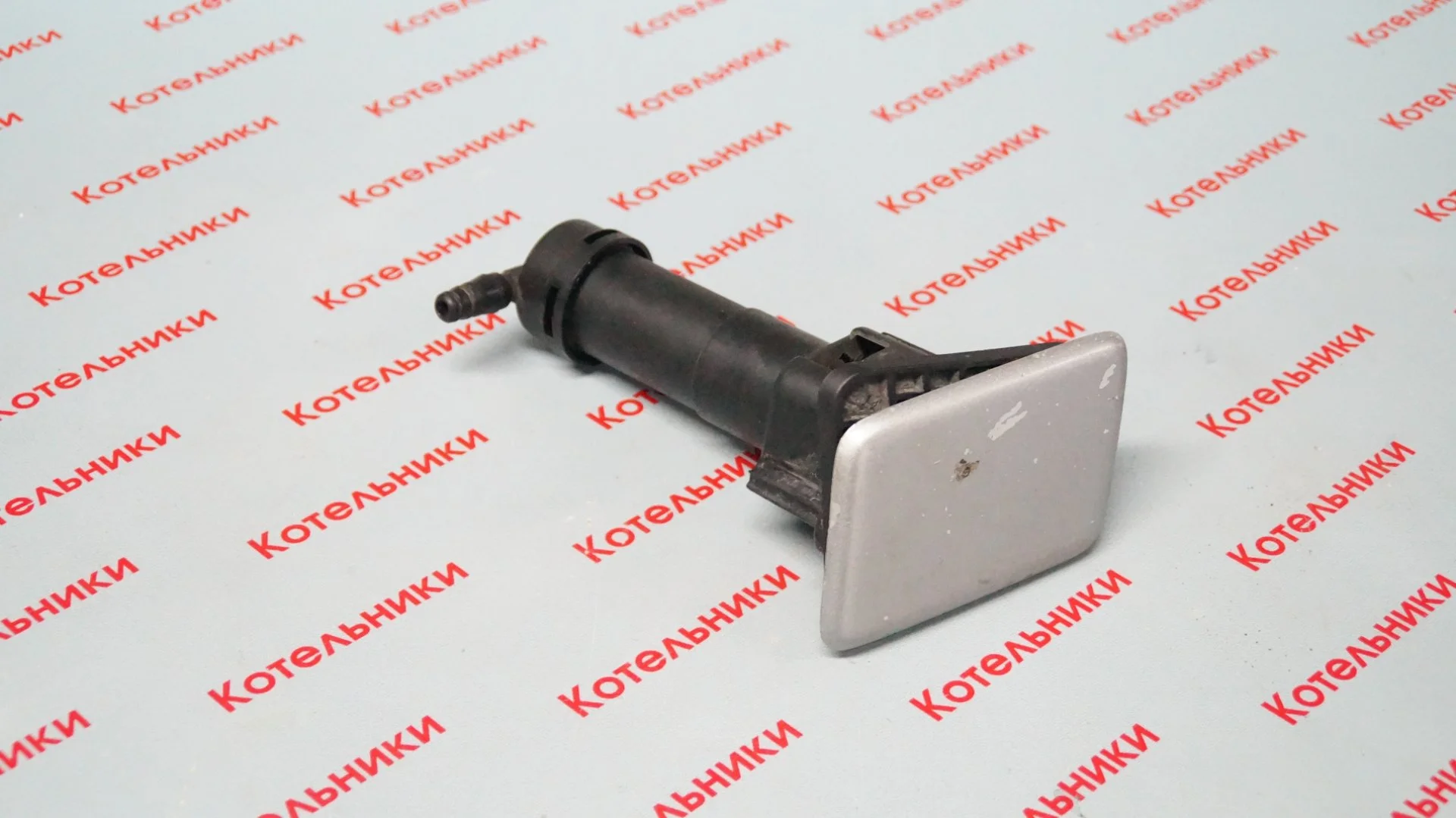 Nissan 28659-AU300 Форсунка омывателя фары L - изображение 1