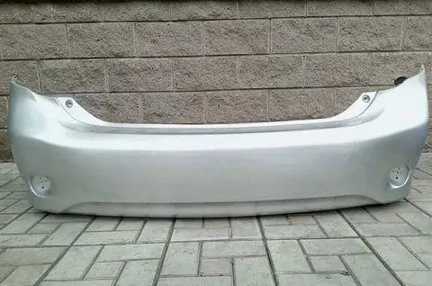 Бампер Toyota Corolla задний e150 все цвета
