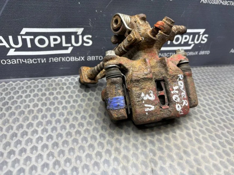 Суппорт тормозной задний левый Rover 400 ХЕТЧБЭК - миниатюра 2