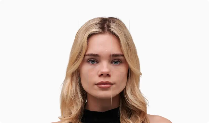 Front portrait of the same blonde woman with the face divided into vertical fifths by dotted vertical lines