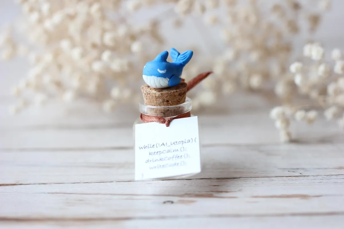 Blue Whale with Code Plaque – 'while(!AI_Utopia){ keepCalm(); drinkCoffee(); writeCode(); }' – Unique Gift for Programmers, Geek Decor 3