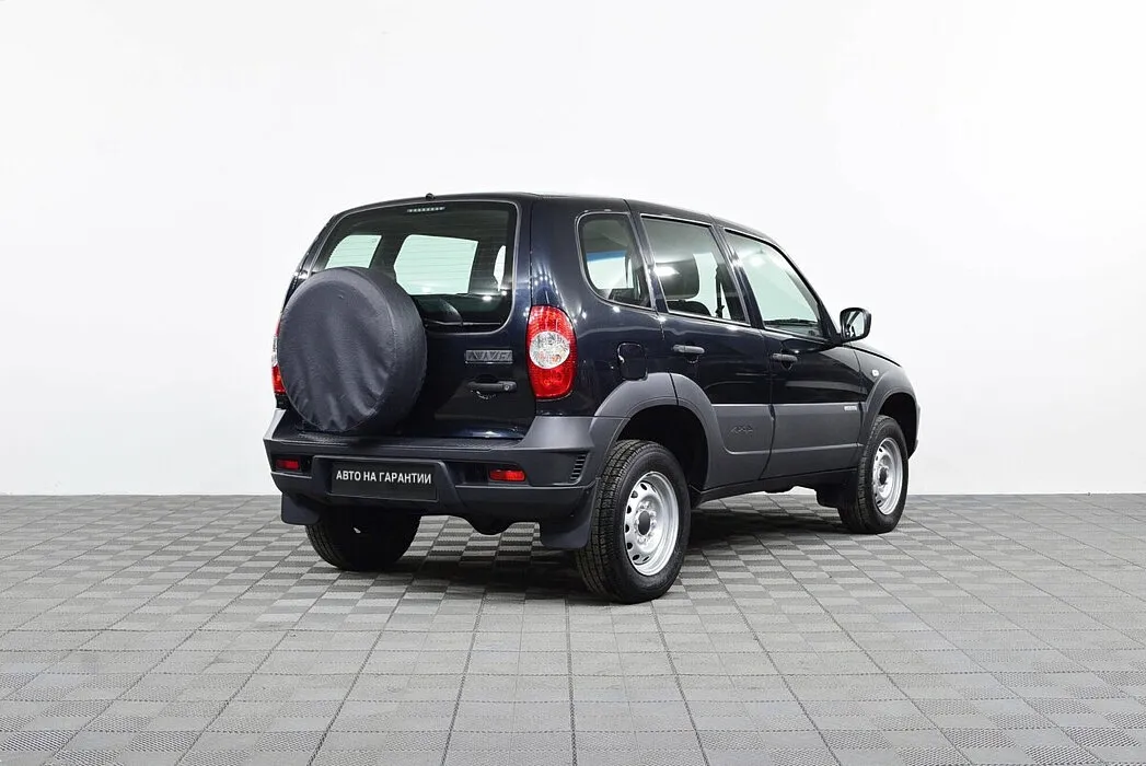 Chevrolet Niva I Рестайлинг · L — фото 4