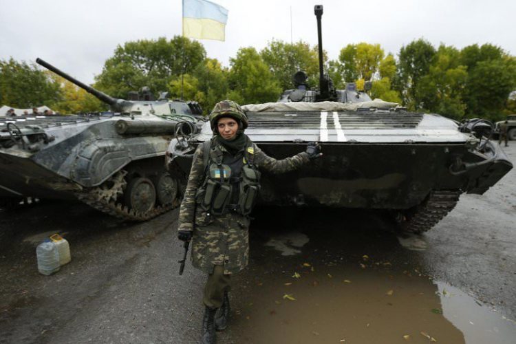 Ukrainian-servicewoman-poses-at-the-military-camp-in-the-village-of-Luhanske