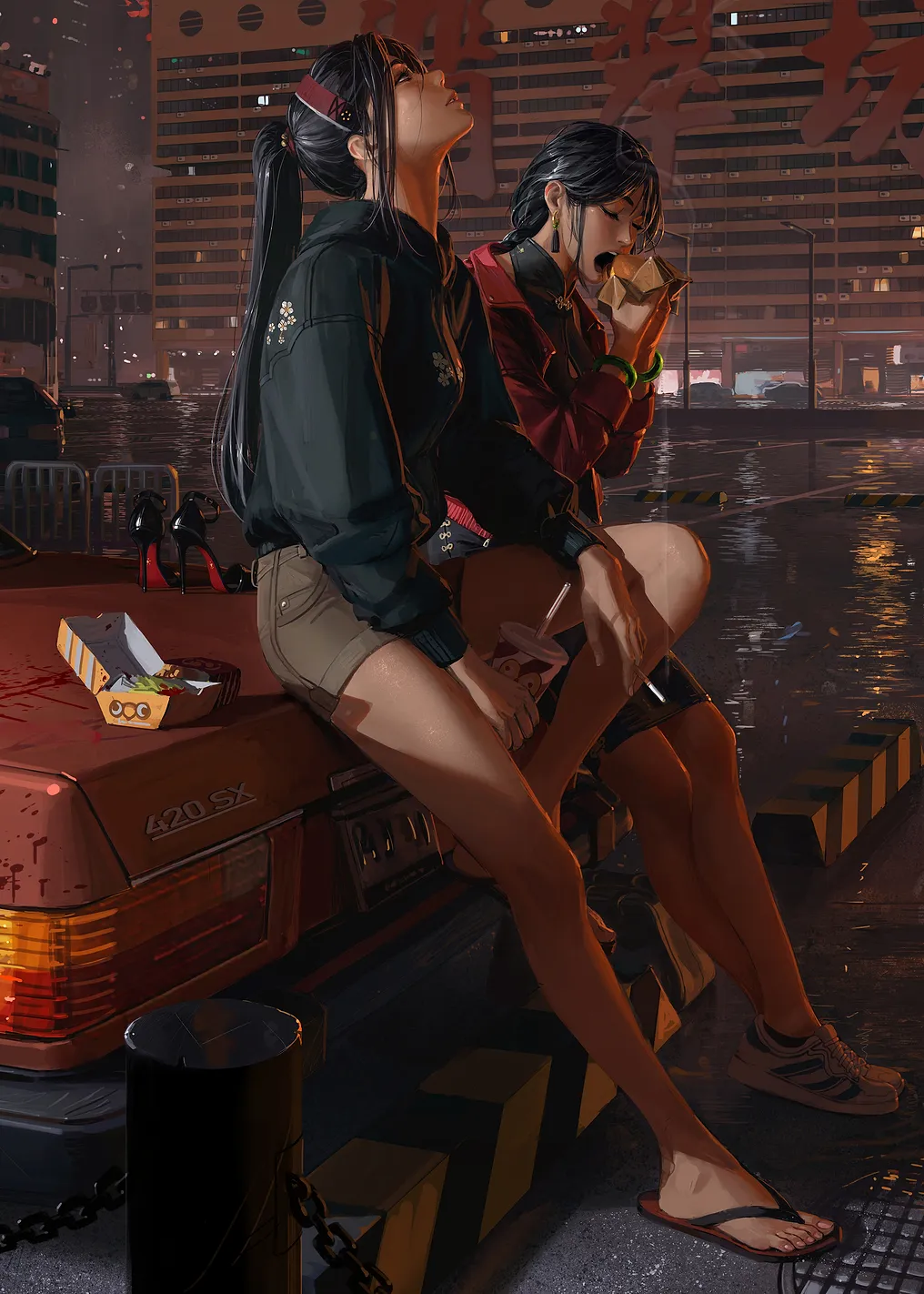 Two women eating fast food at night
