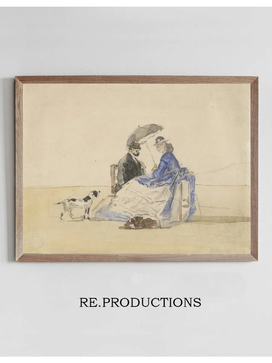 A Couple Seated on the Beach with Two Dogs