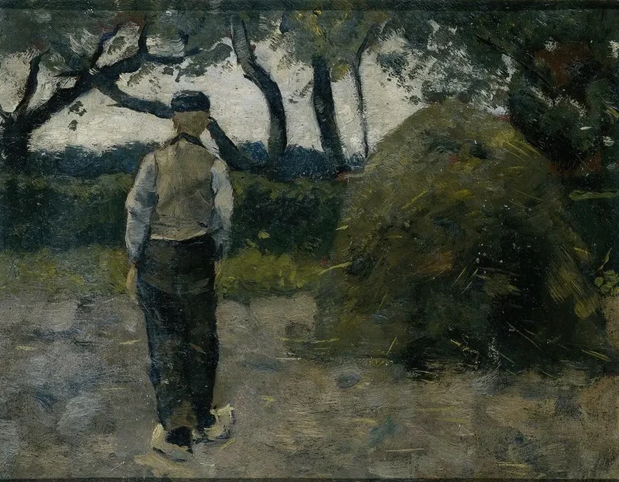 A Farmer standing near a Hay - Stack