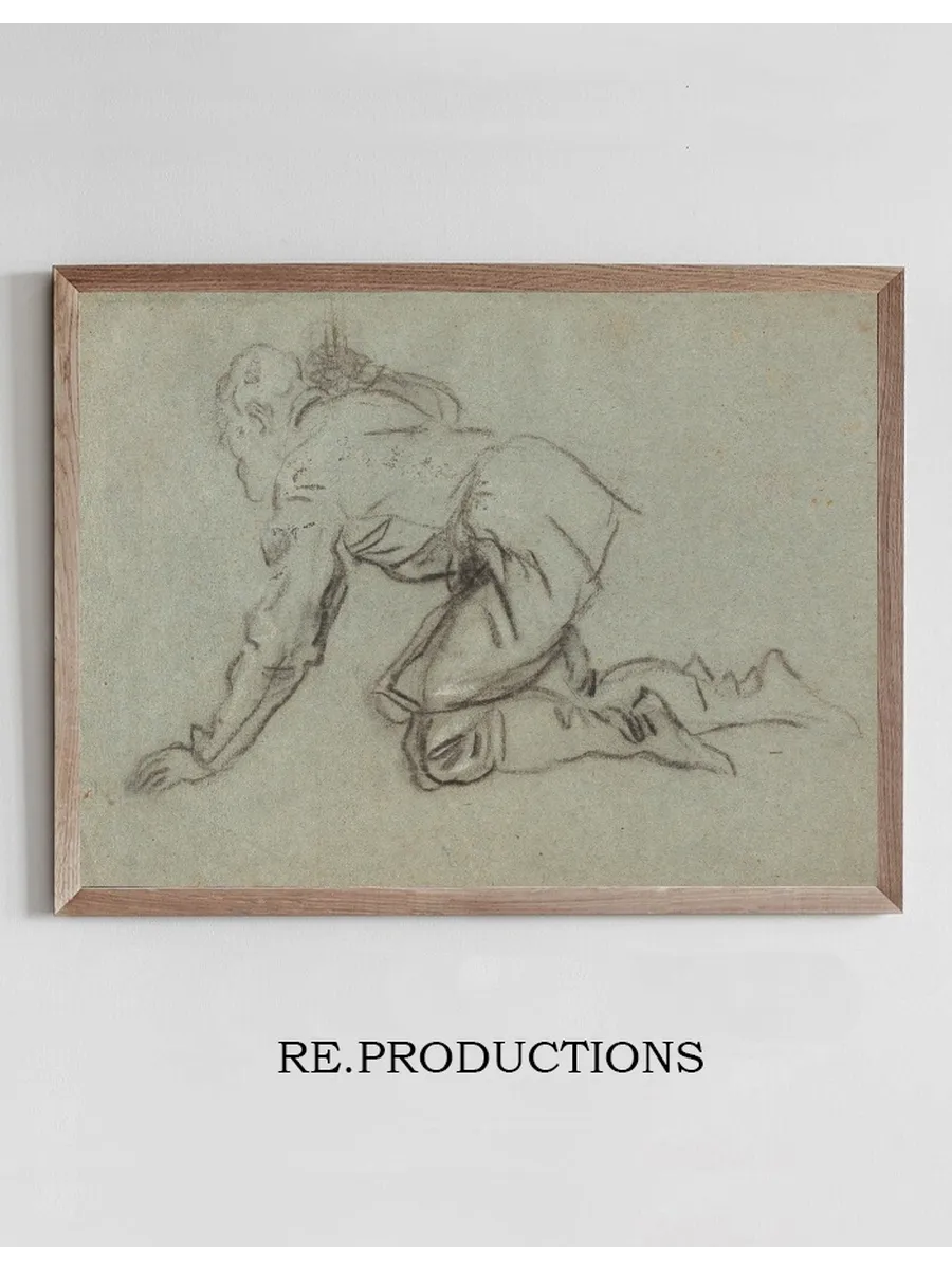 A Kneeling Man Holding a Staff