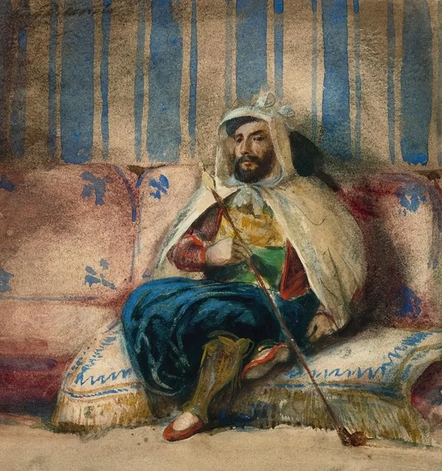 A Man in Oriental Costume Smoking on a Sofa