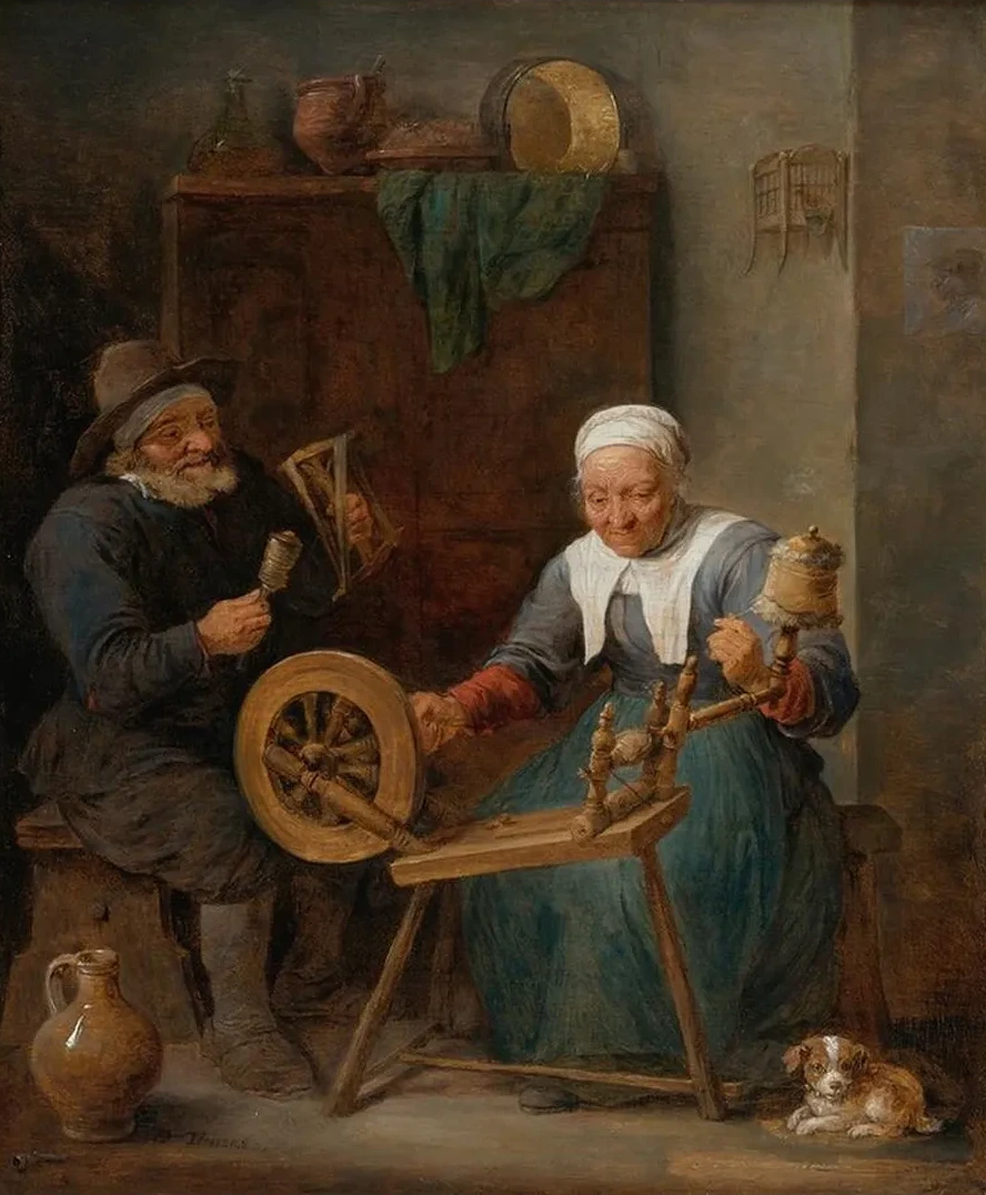 An Elderly Couple Spinning Woolin An Interior