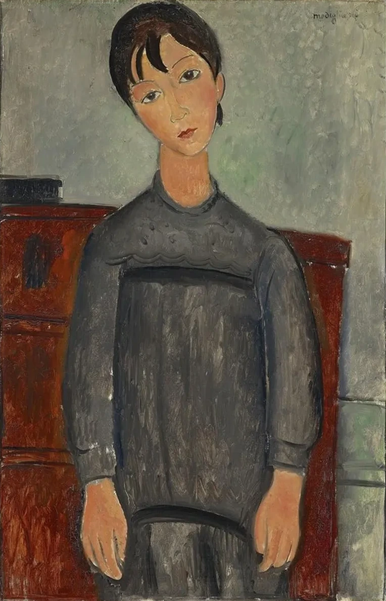 Girl Standing In Black Pinafore