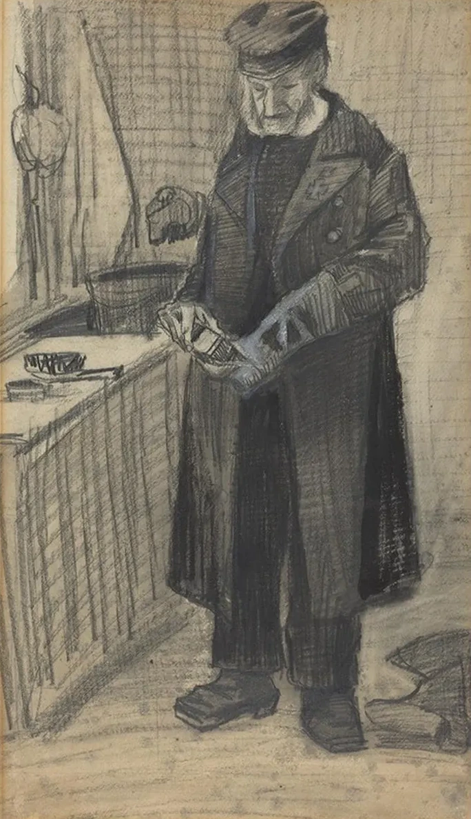 Man Polishing A Boot