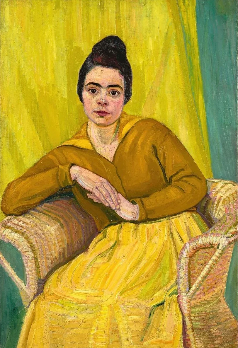 Sitzende Dame im Korbstuhl