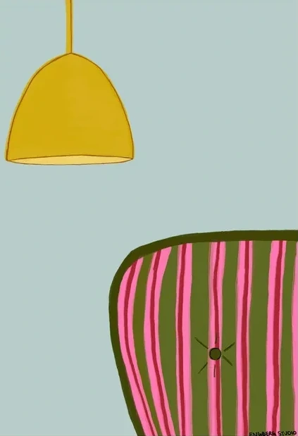 Striped Couch with a Yellow Lamp