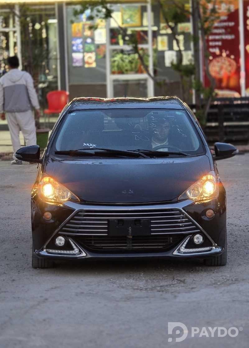 Toyota Aqua • 2014 г • 1.5 л • Автомат • Седан • Передний • Гибрид