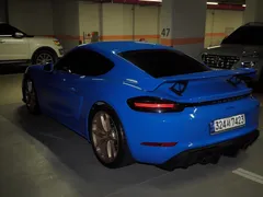2023 Porsche 718 4.0 GT4, синий — фото 2
