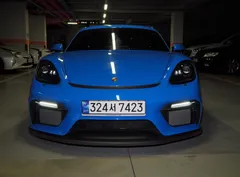 2023 Porsche 718 4.0 GT4, синий — фото 3