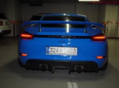 2023 Porsche 718 4.0 GT4, синий — фото 4