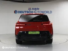 2023 BMW XM 4.4, оранжевый — фото 4