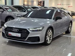 2023 Audi A7 55 TFSI e Quattro Premium, серебристый — фото 1