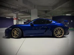 2023 Porsche 718 4.0 GT4, синий — фото 3
