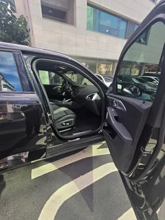 2023 BMW XM 4.4, чёрный — фото 9