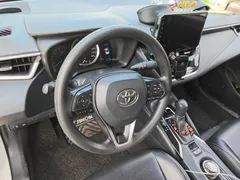2021 Toyota Corolla 1.5L CVT Elite, белый — фото 7
