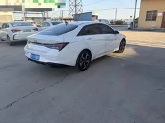 2021 Hyundai Elantra 1.5L CVT TOP Flagship, белый — фото 4