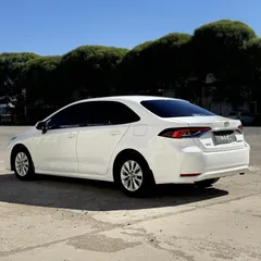 2021 Toyota Corolla 1.5L CVT, белый — фото 4